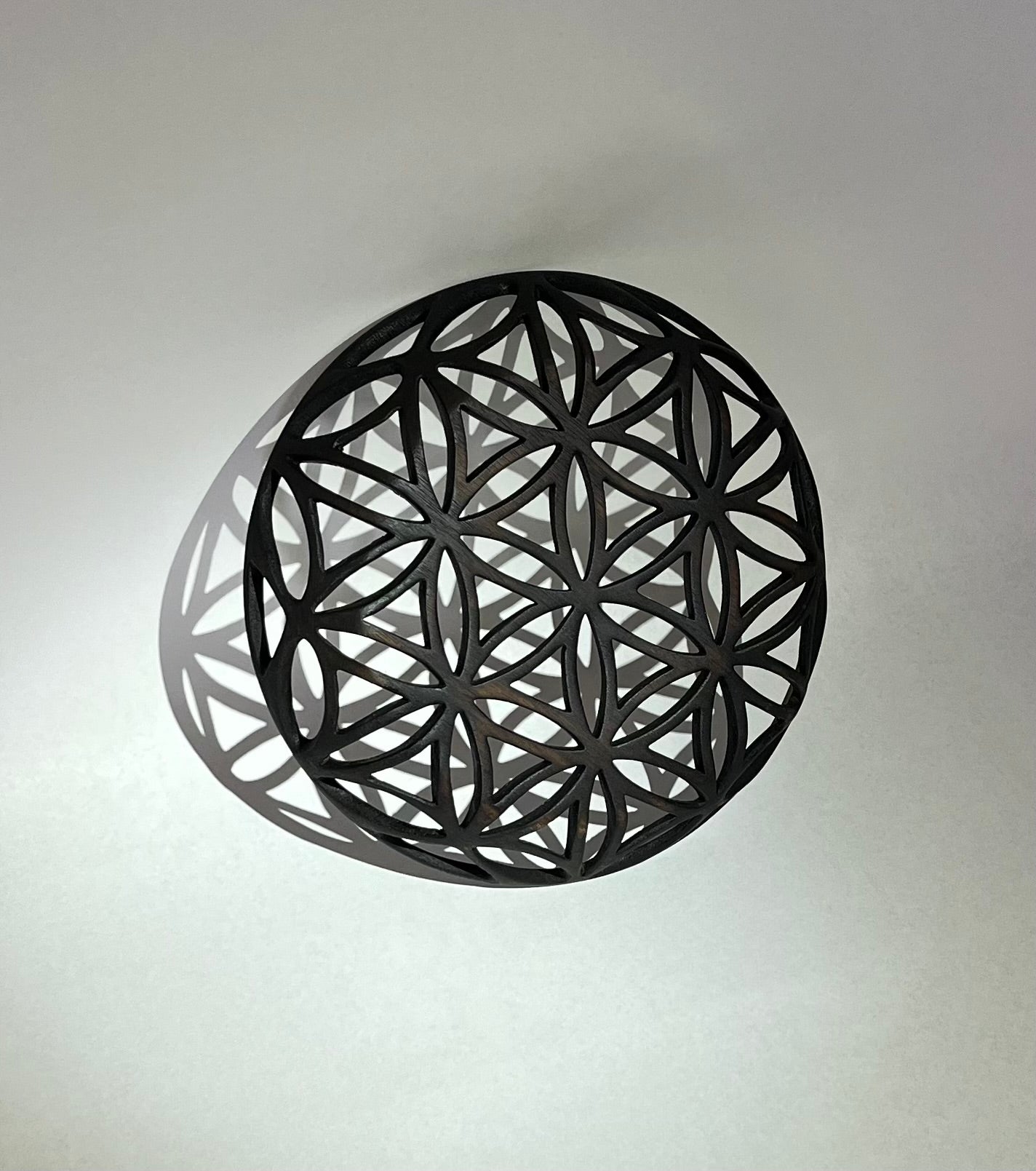 Walnut carved decorative bowl with flower of life illusion